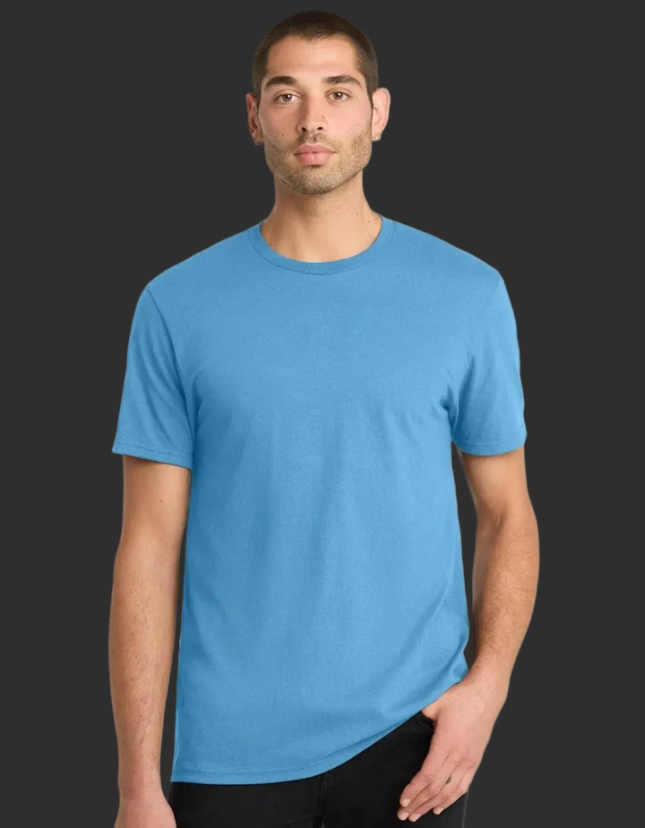 Man wearing a blue t-shirt against a black background