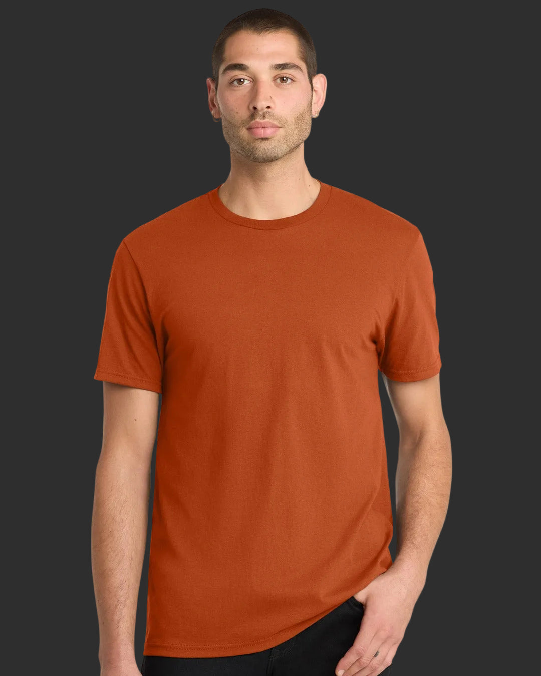 Man wearing a rust-colored t-shirt on a white background